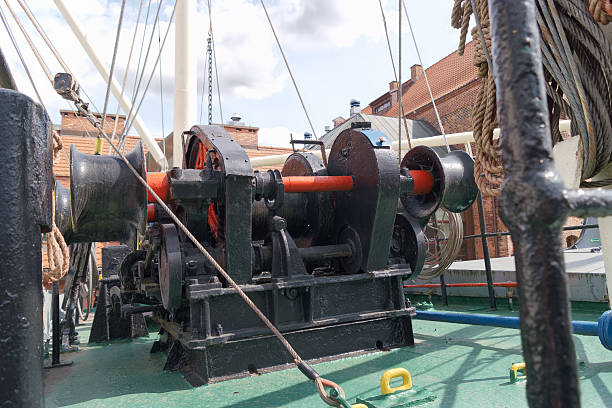 istock Historic ship machinery on deck during a sunny day at the waterfront showcasing maritime engineering 2246357709
