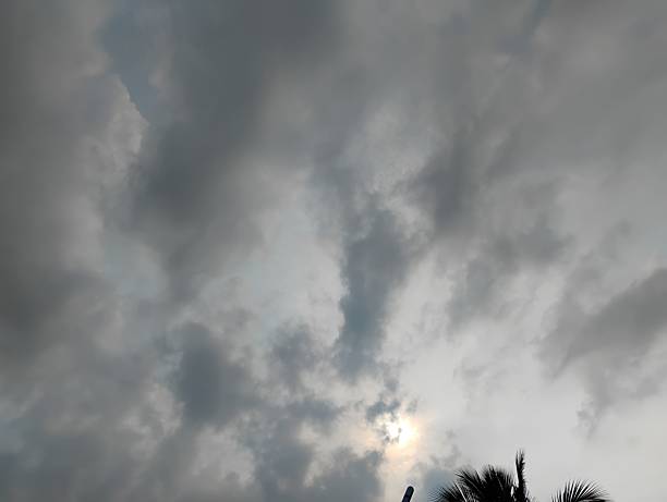 istock Artistic rainy thunder clouds are visible around the evening sunlight. 2246358319