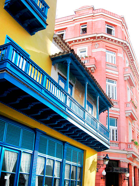 Colonial architecture in old Havana , narrow city street in historic district, Havana, Cuba