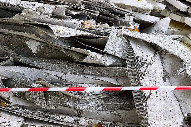 istock Construction debris.Old insulation material removed from walls.Fenced red tape 2246359935