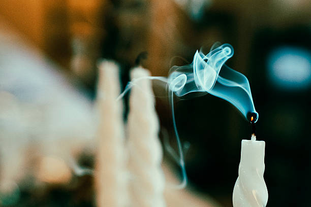 istock Smoke Rising from Extinguished Candle Closeup 2246360066