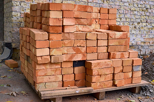 istock Construction. Stacked bricks on a wooden pallet, ready for installation. 2246360174
