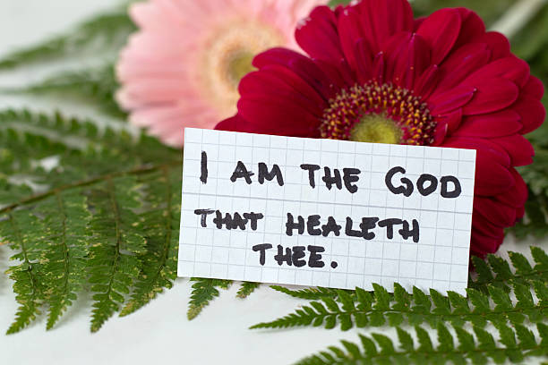 istock Inspirational handwritten quote for God's healing on a note with flowers 2246360179