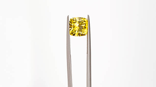 istock A yellow gemstone is displayed in a jeweler's setting 2246362453