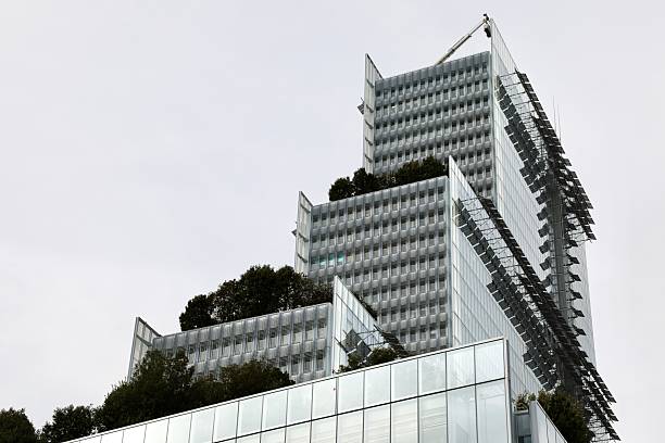 The Tribunal de Paris, a striking example of sustainable architecture, features a tiered glass design incorporating rooftop gardens and energy-efficient systems. Designed by architect Renzo Piano, the building integrates greenery on multiple levels to improve air quality and reduce the urban heat effect, symbolizing a commitment to environmental responsibility in modern urban design. Located in the Clichy-Batignolles district, this eco-friendly courthouse exemplifies innovation and transparency in public architecture