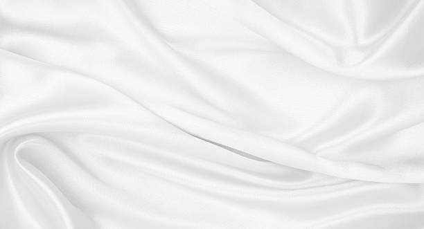 istock Smooth elegant white silk or satin luxury cloth texture as wedding background. Luxurious background design 2246365089