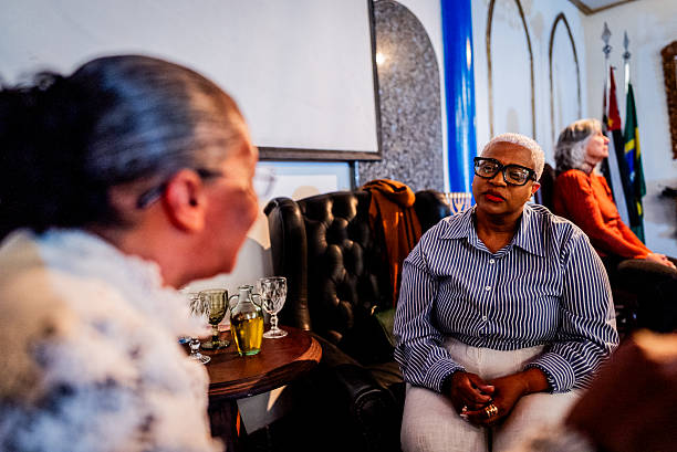 Pastor speaks with parishioner individually after service