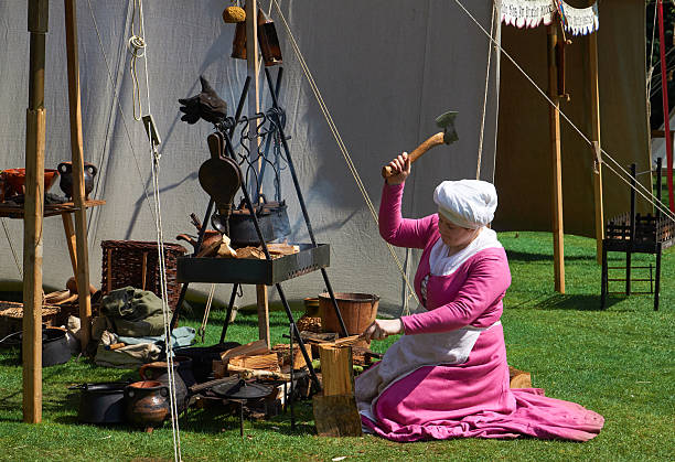 Silsoe, United Kingdom 22 April 2018 - Actors in medieval costumes recreate Saint George's battle with the dragon during Silsoe festival