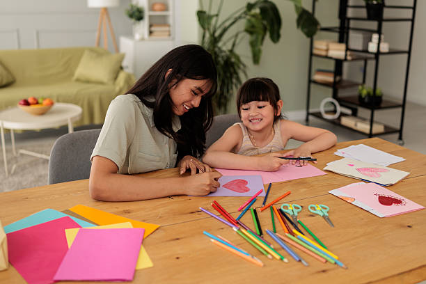 istock Sisters Doing Art Project Together at Home 2246380271