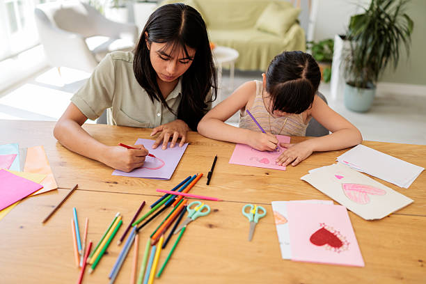 istock Sisters Enjoying Arts and Crafts Together 2246380800