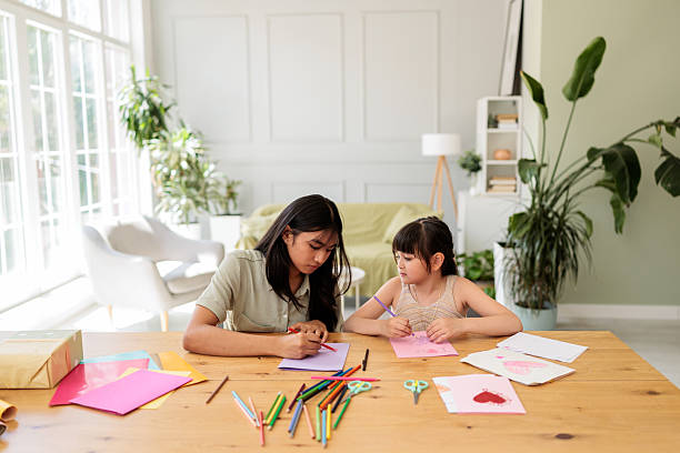 istock Sisters Drawing Together at Home 2246380891