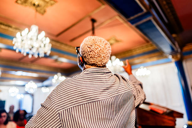 Female pastor preaching during religious service