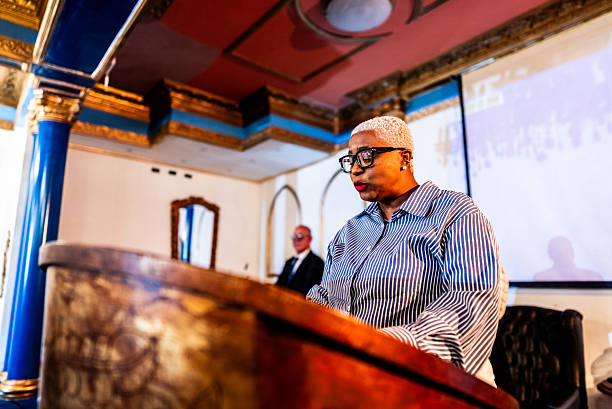 istock A pastor preaching to the faithful during a religious service 2246381005