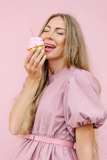 istock Happy Woman About To Eat Cupcake 2246381225
