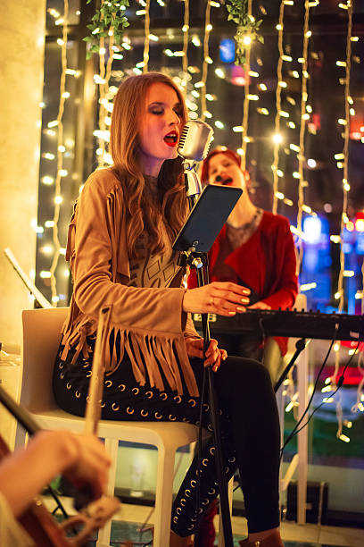 Small musical band playing on the event in the restaurant.