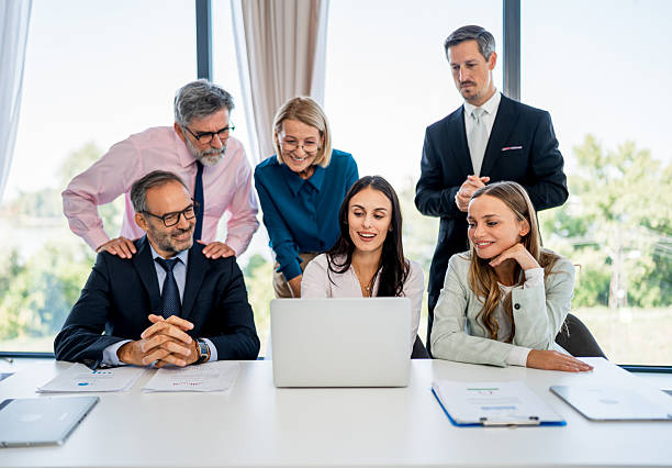 istock Business team collaborating on laptop at office meeting 2246382045