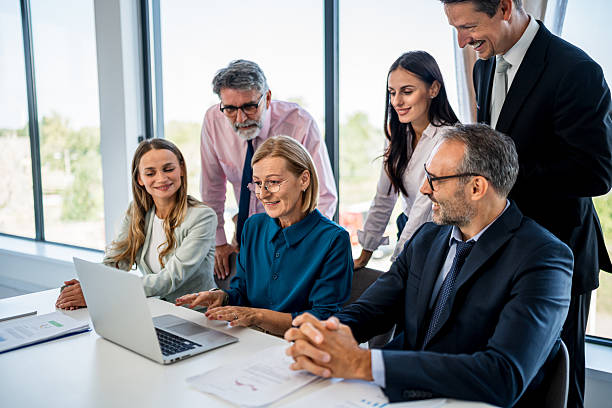 istock Business team collaborating on laptop during office meeting 2246382074