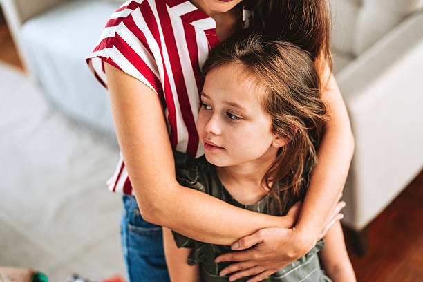 istock Mother hugging her daughter with love and tenderness 2246382900