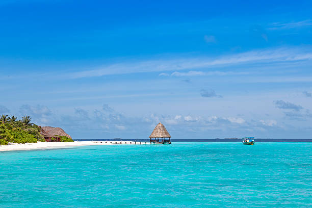 istock Jetty over blue ocean to island 2246383441