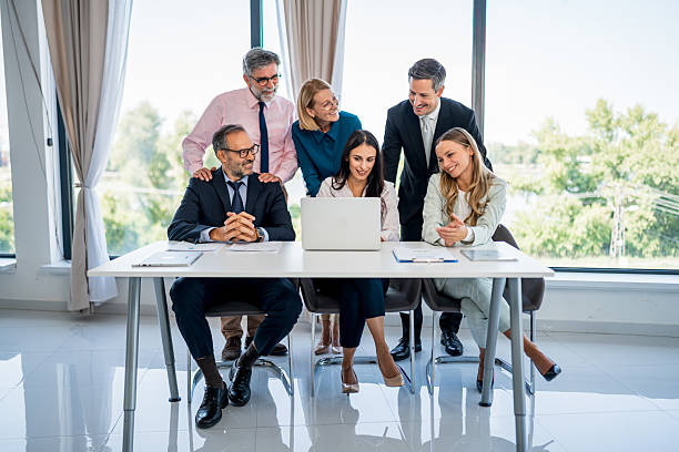 istock Diverse business team collaborating on laptop during office meeting 2246384214