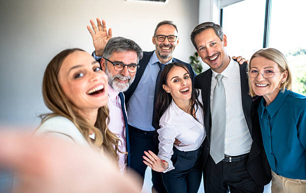 istock Happy diverse business team taking selfie in office 2246384326