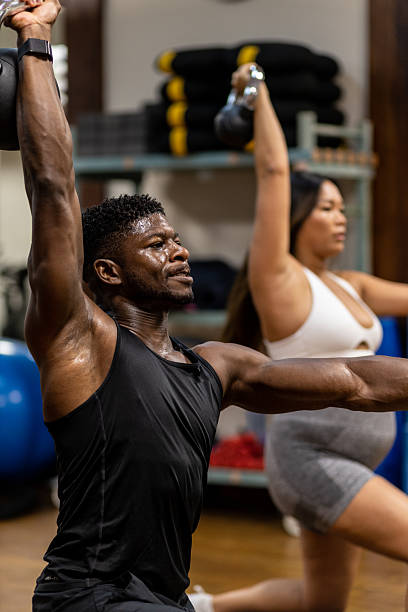 istock Multiracial Couple Doing Strength Training in Gym 2246385941