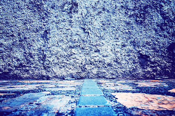 Stone floor and wall background. Close-up view of the street floor.