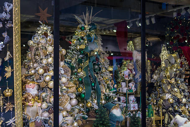 istock luxury christmas tree window display with white and gold decorations at a retail store for holiday shopping, visual merchandising, and concept of seasonal retail 2246389652
