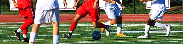 istock Exciting Soccer Match Takes Place on a Sunny Day 2246390385