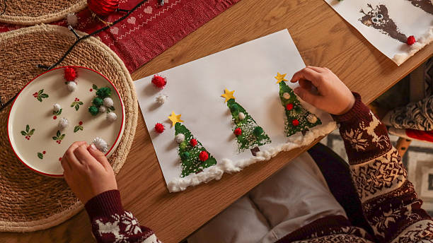 istock Early learning ideas. Christmas Tree from pom pon. Activities for Toddlers and Preschool Children 2246400515