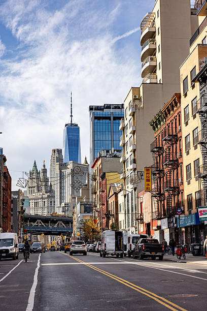 istock Downtown Manhattan street view featuring One World Trade Center skyscraper 2246401191