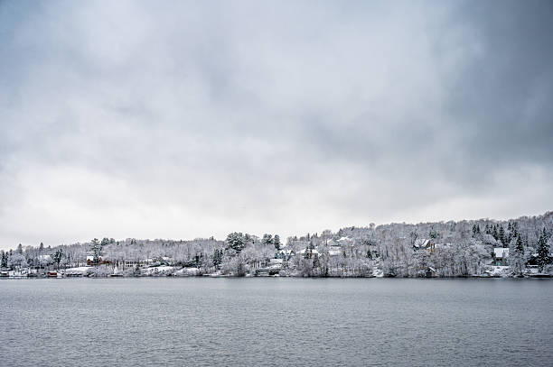 istock Beauport lake and snowy mountain 2246401710
