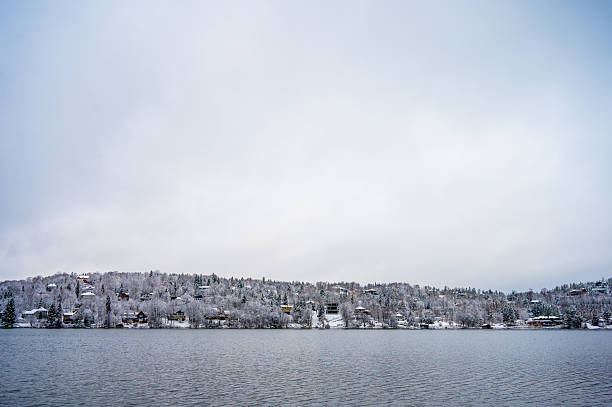 Beauport lake and snowy mountain during a winter day