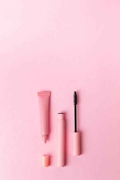istock Mascara and lip gloss on pink background. 2246405886