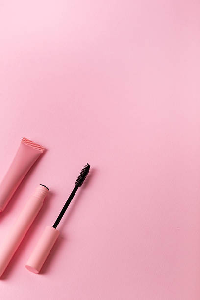 istock Mascara and lip gloss on pink background. 2246405946