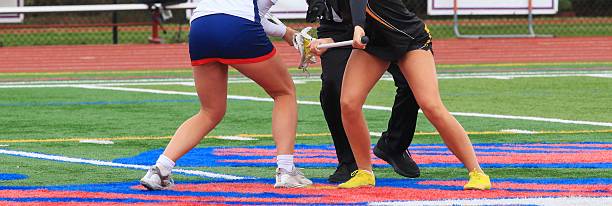 istock Two Players Compete for the Ball During a Lacrosse Faceoff 2246405970