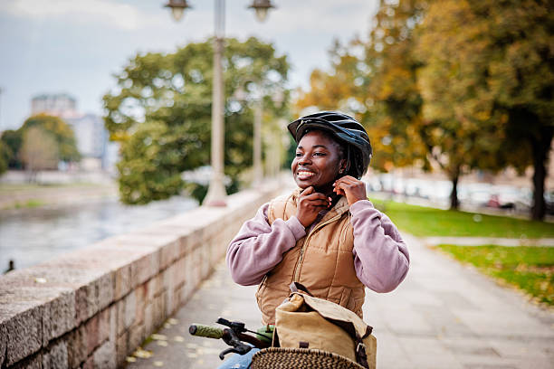 istock Happy Girl Adjusting Helmet Before Ride 2246409300