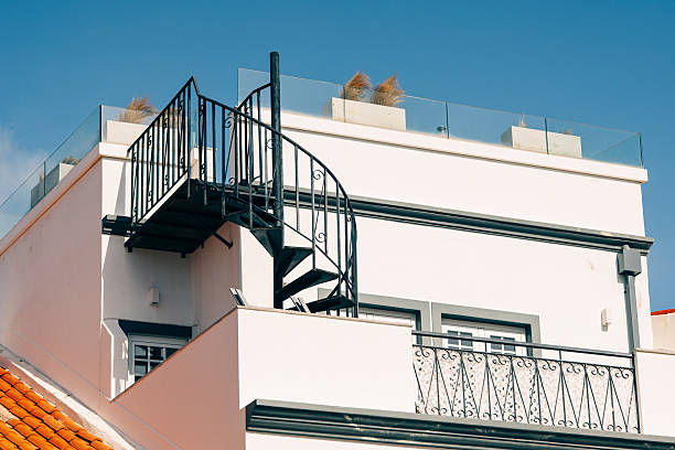 istock Rooftop terrace with black spiral staircase 2246410866