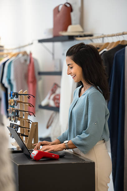 istock Happy Hispanic retail store manager checking sales records 2246412792