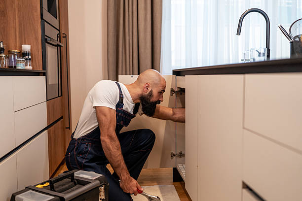istock Reliable home service: kitchen repair in progress 2246419509
