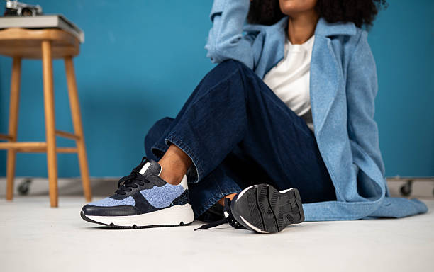 istock Woman posing with sneakers in studio 2246419582