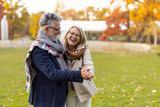 istock Joyful seniors enjoying dance in colorful autumn setting 2246428855