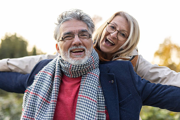 istock Cheerful couple expressing joy in scenic open space 2246428873