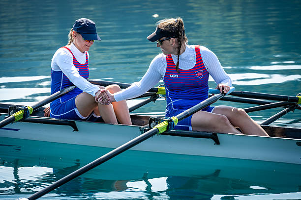 istock Female Rowers in Double Scull on Serene Lake 2 2246429064