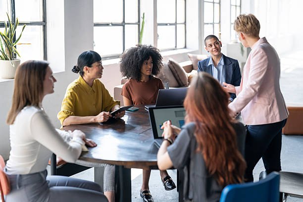 istock Businesswomen collaborating on project in modern office 2246430689