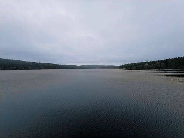 istock serene tranquil landscape, isolated wilderness setting with calm waters and subdued colors 2246432847