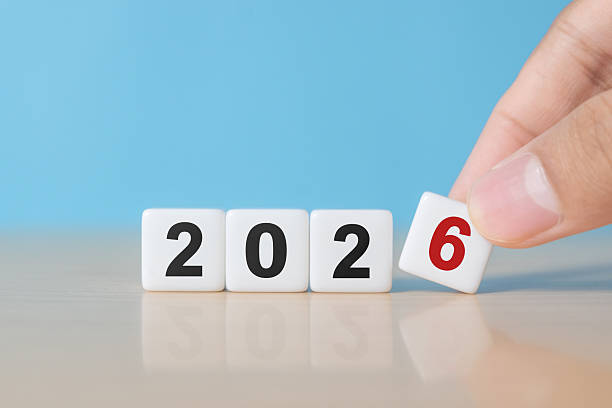 istock Dice with the letters 2026 on a blue background 2246435199