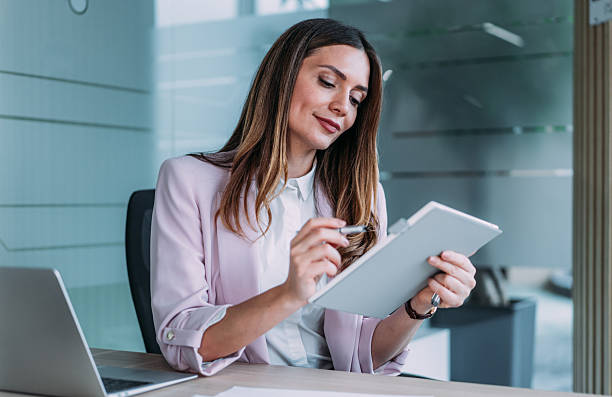 istock Confident businesswoman in modern office. 2246435289
