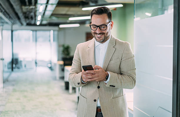 istock Businessman texting in the office. 2246435301