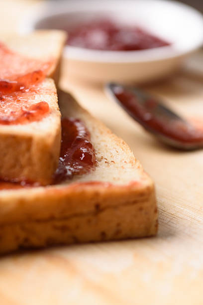 istock Strawberry jam for a classic breakfast on wooden background 2246435746